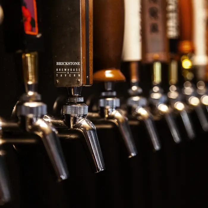 A row of draft beer tap handles