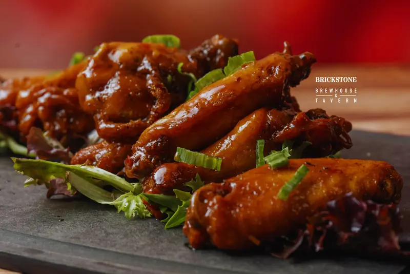 Glazed wings garnished with herbs